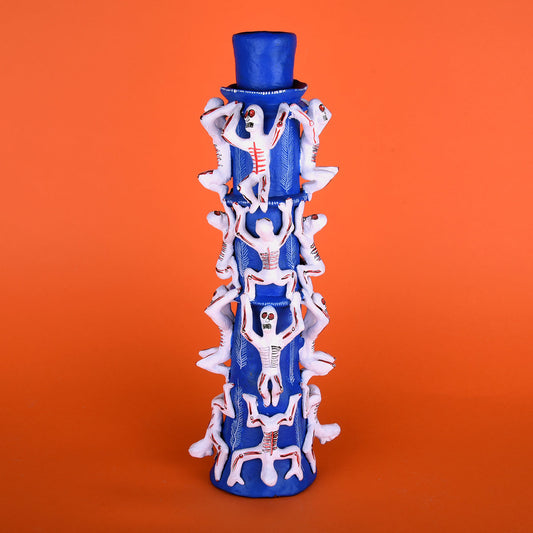 Candle holder with skulls
